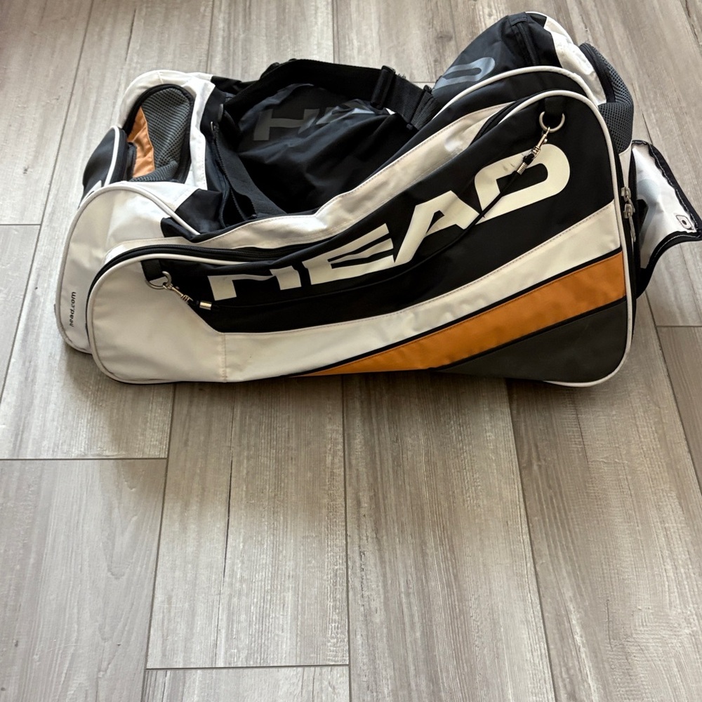 HEAD Black, White, and Orange Duffel Bag